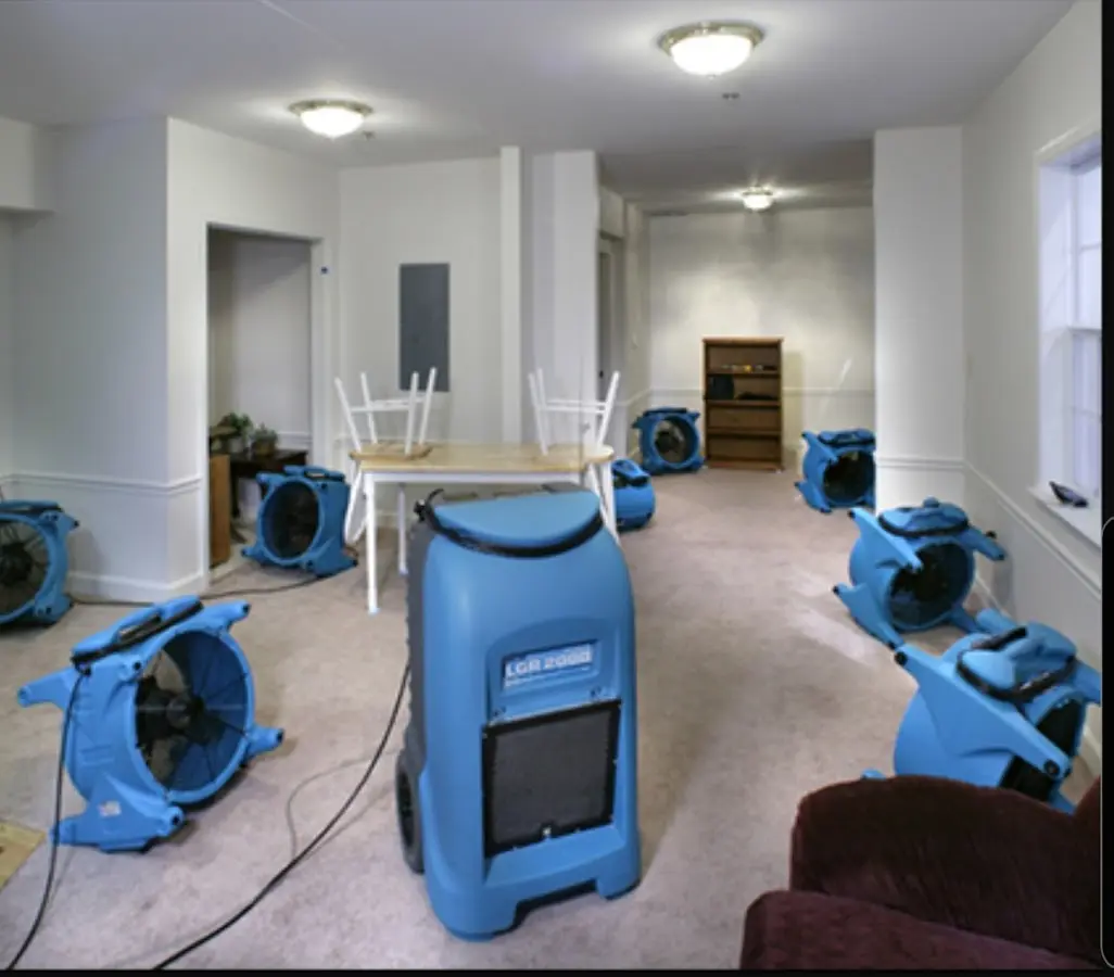 Air movers and dehumidifier setup for Water Damage Restoration in Kings Park West